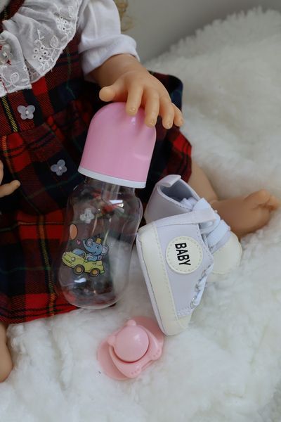 Реалістична лялька Реборн Reborn Doll 55 см, вініл-силіконова дівчинка кучеряшка в одязі з аксесуарами DO-27 фото