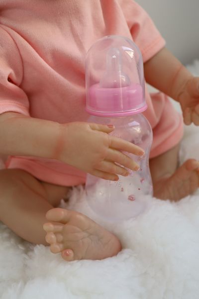 Лялька Реборн Reborn Doll 50 см, реалістична вініл-силіконова дівчинка пупс в рожевому одязі+аксесуари DO-34 фото