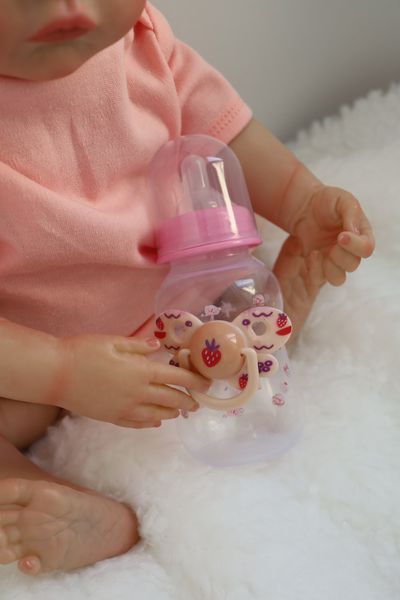 Лялька Реборн Reborn Doll 50 см, реалістична вініл-силіконова дівчинка пупс в рожевому одязі+аксесуари DO-34 фото